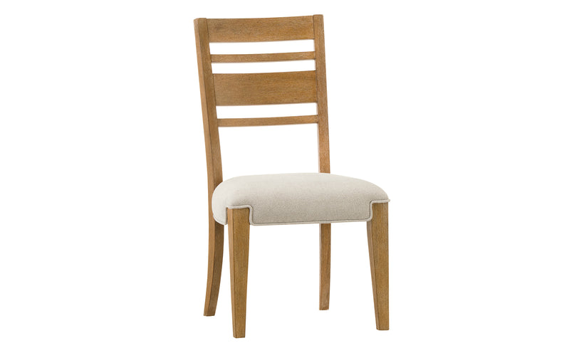 Wooden chair with a white cushion on a white background